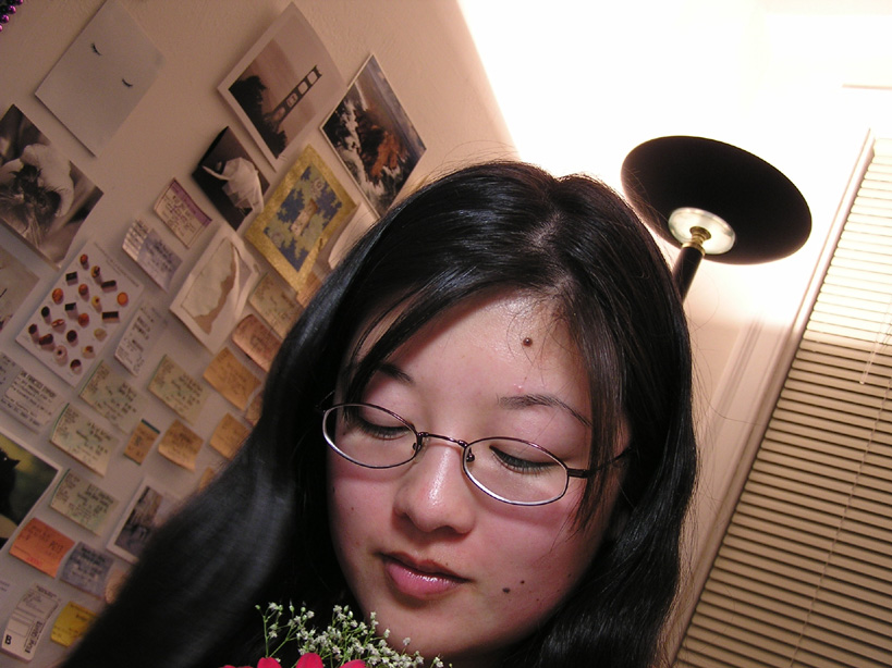 Lisa looking down at flowers