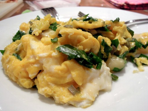 Scrambled eggs with chopped ramps and oka cheese