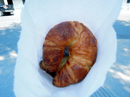 White paper bag with pastries in it