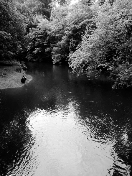 Erik investigating the river (b/w)