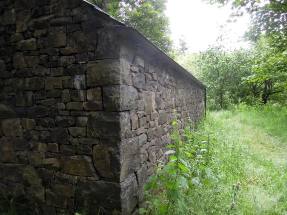 A corner of the stone house -- I love the way the stone is arranged. I've never gotten very familiar with Goldsworthy's work but I've been fascinated with the pieces I've seen in books and online. Corner of the stone house, with roughly hewn smallish stones set together in irregular arrangement