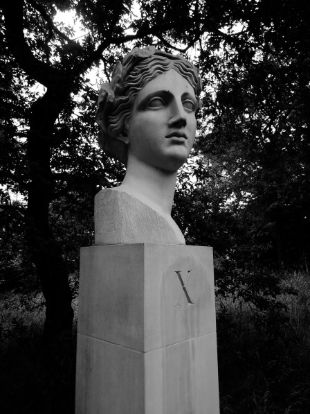 X marks the muse. Head of Sappho on a pedestal with a serif X on it, in black and white.