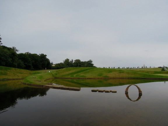 The stone arch and its reflection totally make me think of the "O" of Oprah's magazine. Stone arch reflected in the water of the Life Mounds