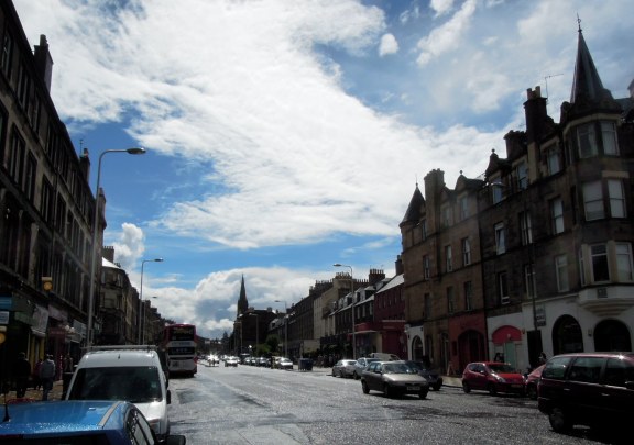 View to city from Leith Walk: wet street, sunny sky