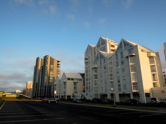 Tall cluster of white apartment buildings