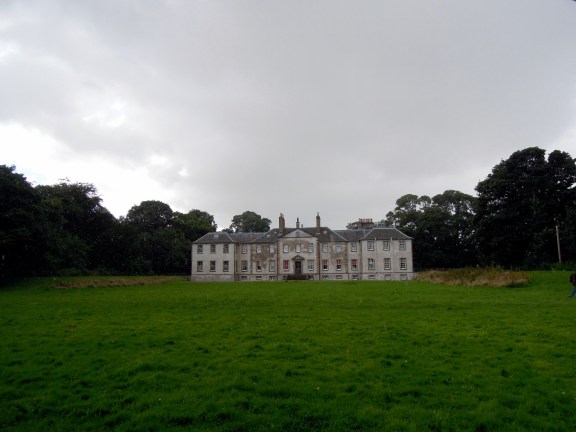 Newhailes with trees in the background and lawn in the front