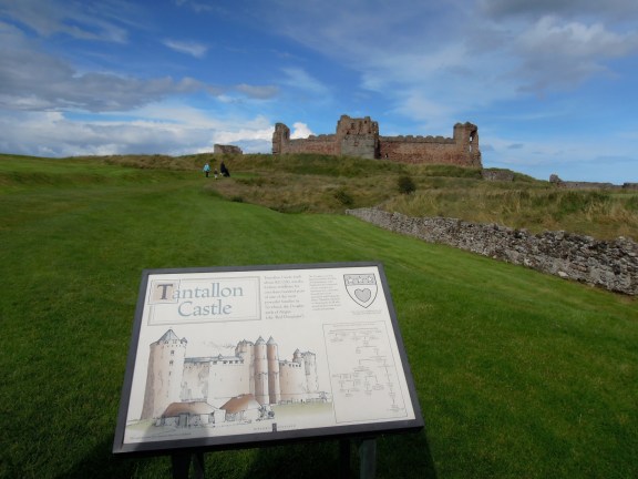 It was amazingly low-key to enter the castle: just ยฃ5 per person, through the back door of the gift shop, and then there we were! Signboard and castle