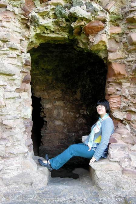 Me trying to look natural and relaxed. I'm in one of the arched doorways off that hallway in the photo above. Lisa trying to look natural in one of the doorways
