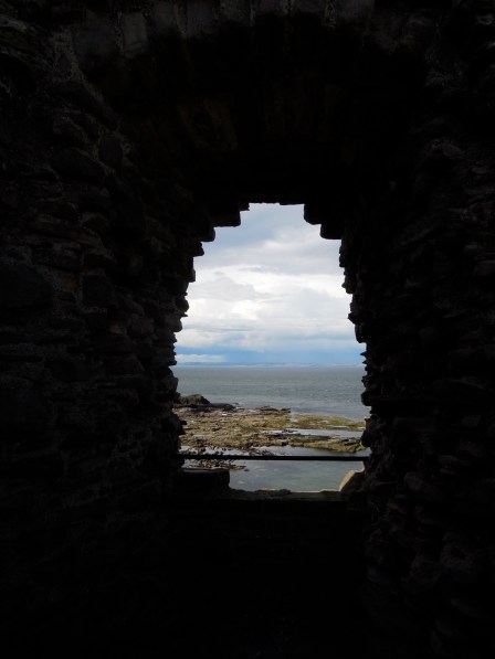 View of the ocean through a window View of the ocean through a window