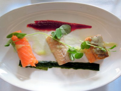 Salmon with crab, eel, and more salmon. Beetroot purée and pickled cucumber.
