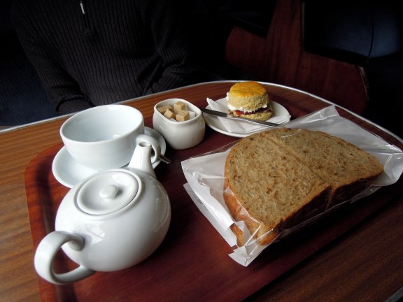 Tea, cream scone, and takeaway sammiches at the Glenfinnan Dining Car