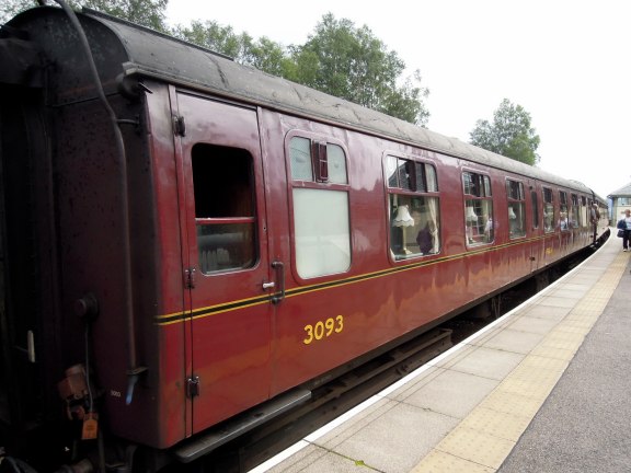 The distinctive red cars of the Jacobite Steam Train