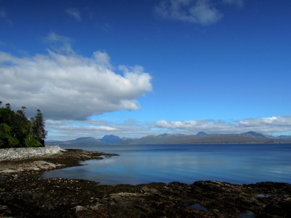 We went around the turn until we were past that point you can see on the left (with the trees), and then saw that the view from there was pretty much the same. So that's where we turned around. Skye coastline