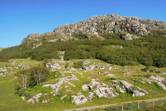 This was the view out my window almost immediately after we pulled out of Mallaig station. Green mountain topped with grey stone