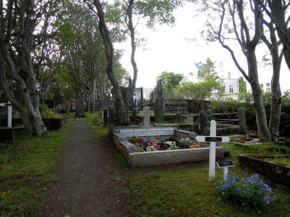 Flowers, both real and fake, inside the cemetery
