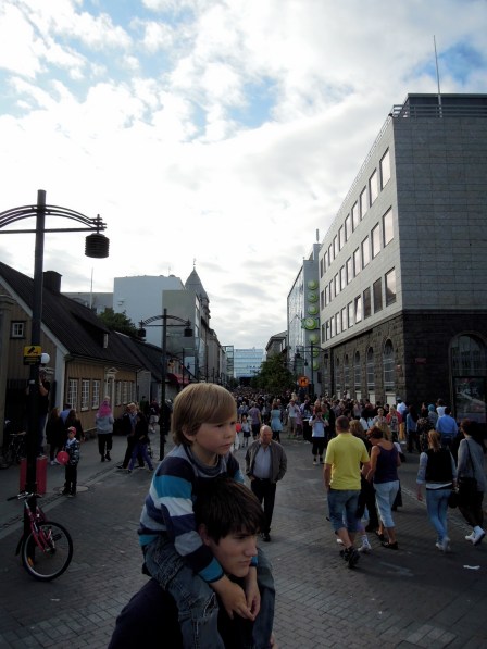 Young man with his young son on his shoulders