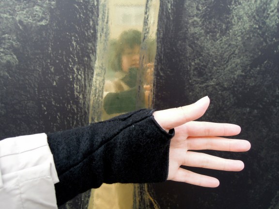 Lisa's left hand in black felt mitt