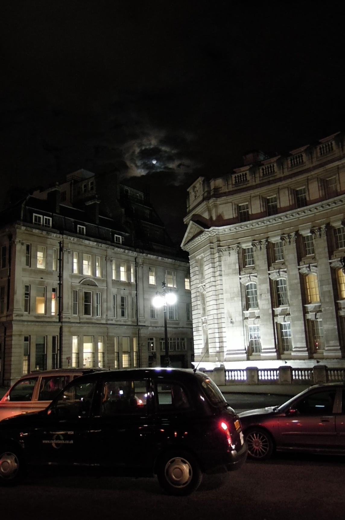 Full moon over buildings