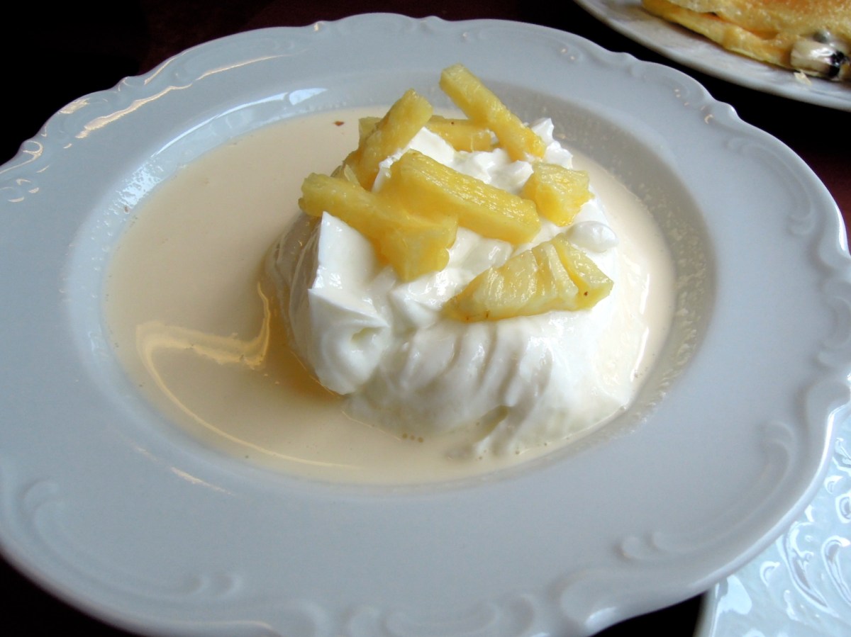 Skyr topped with pineapple and cream. 