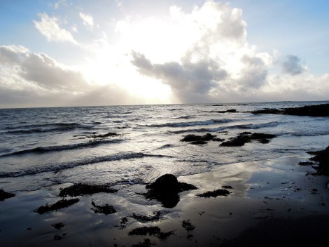 Gentle waves on the black beach