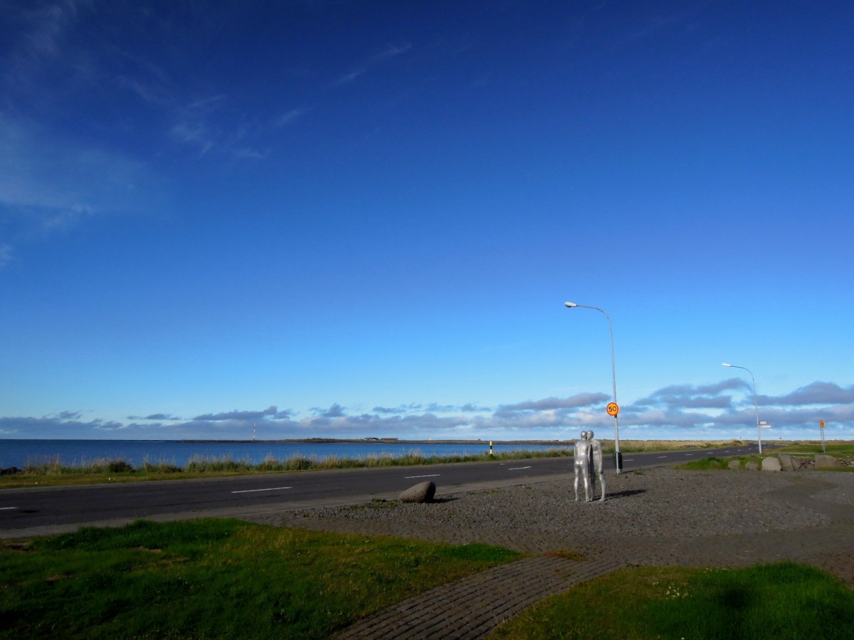 Sculpture of two figures leaning on each other