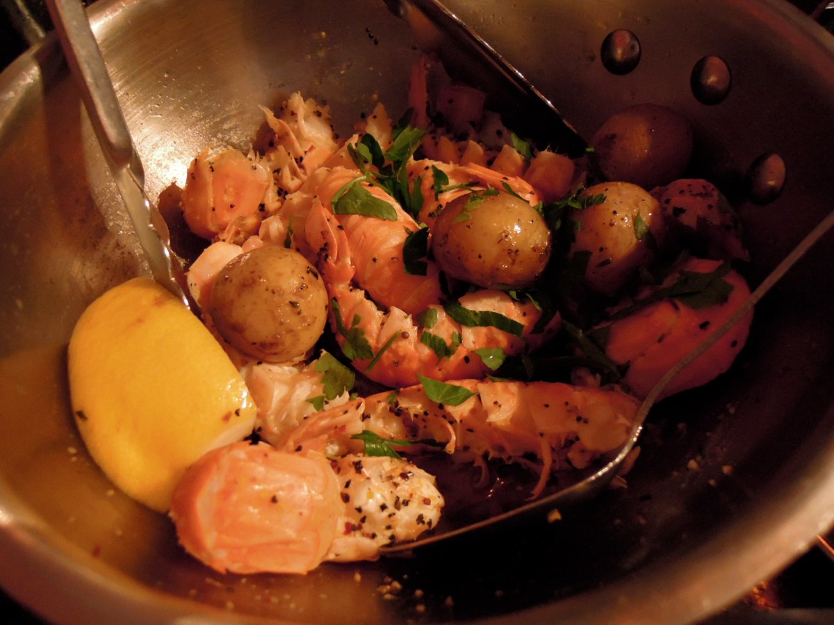 Langoustines and small potatoes in herb-garlic butter.