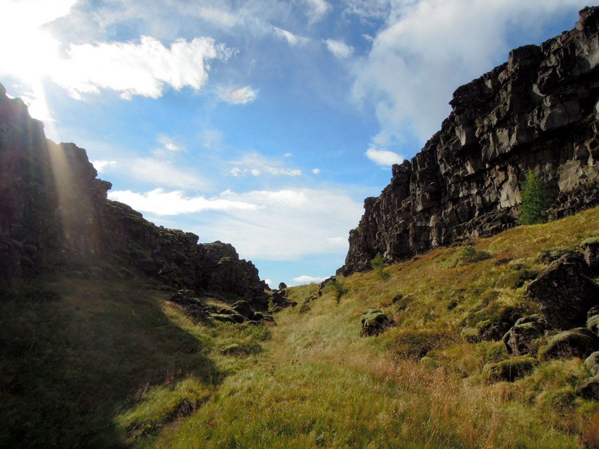 Grassy trail between cliffs