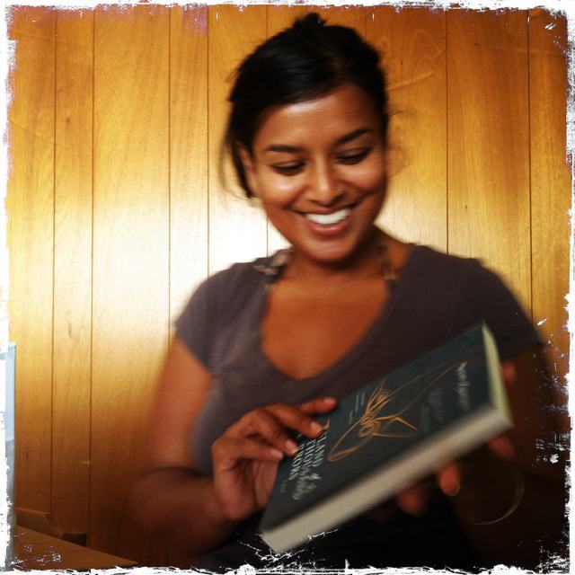 Nayomi beaming at her book