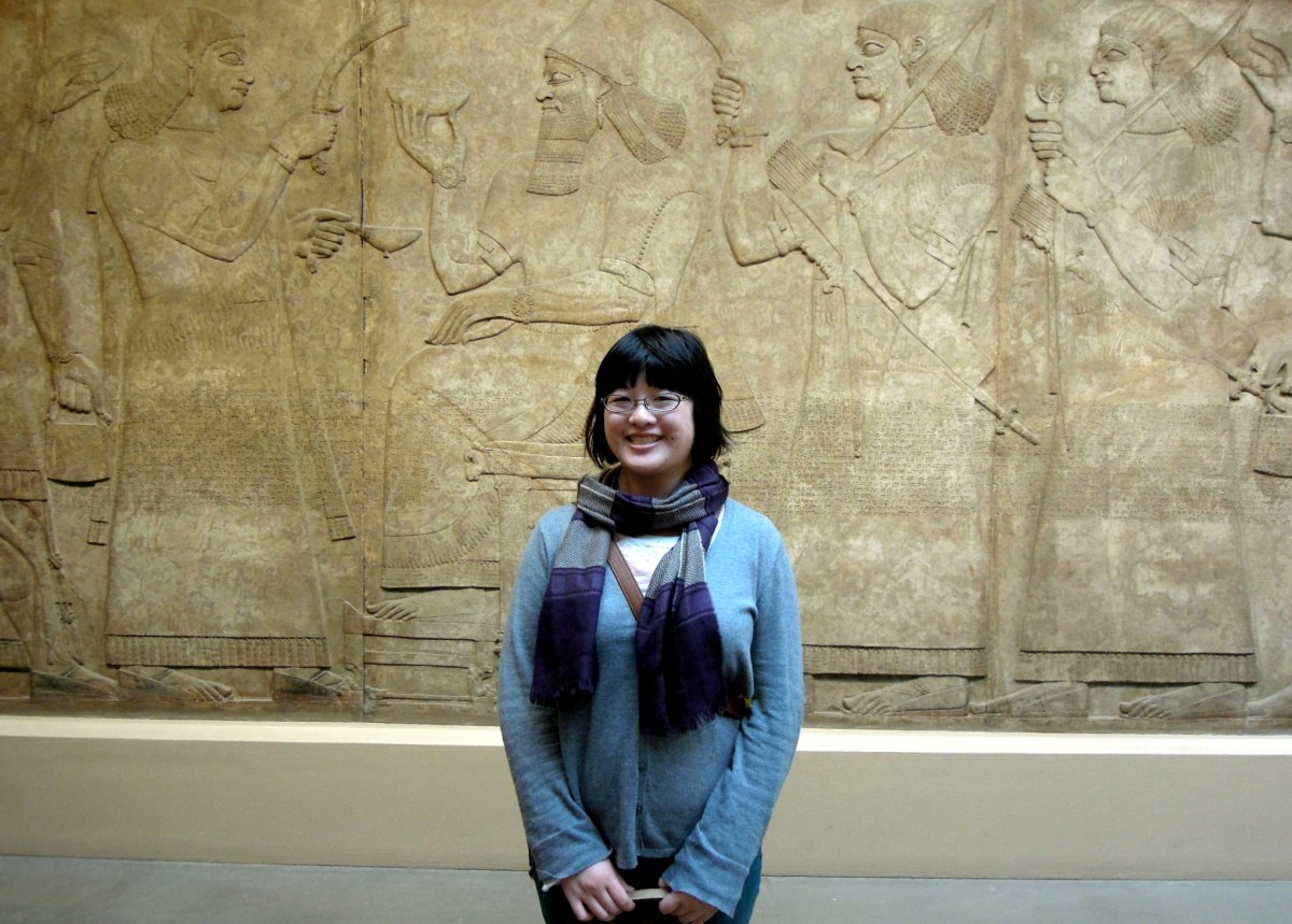 Lisa in front of Assyrian reliefs