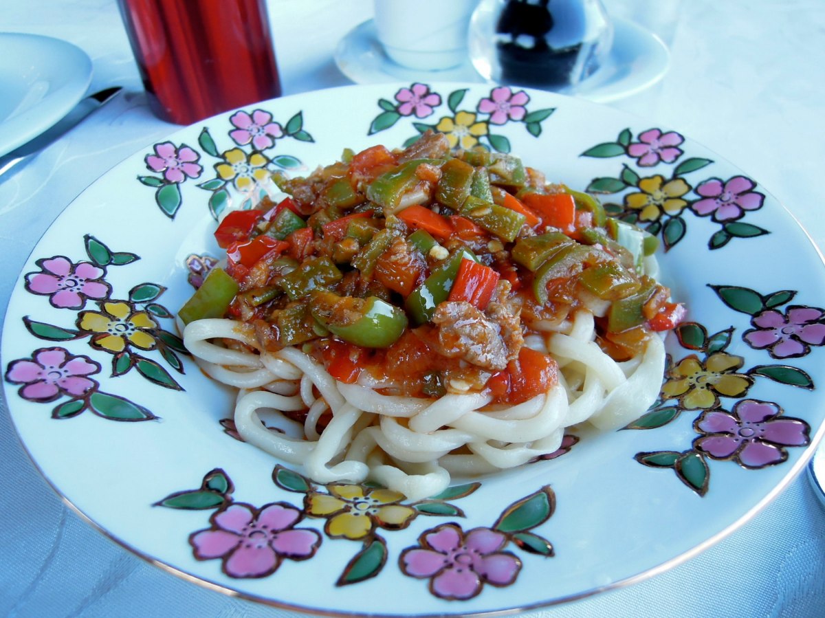 Uighur lagman (handmade noodles) topped with ground meat and diced vegetables