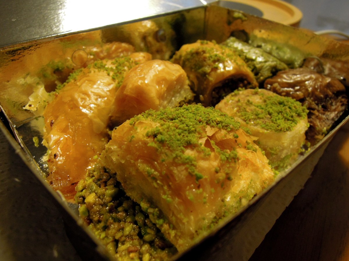 Yum. I don't remember now what these all were, but the dark one is chocolate (really good!), the green one is super-über-pistachio, and the others were either pistachio or walnut. Assorted baklava