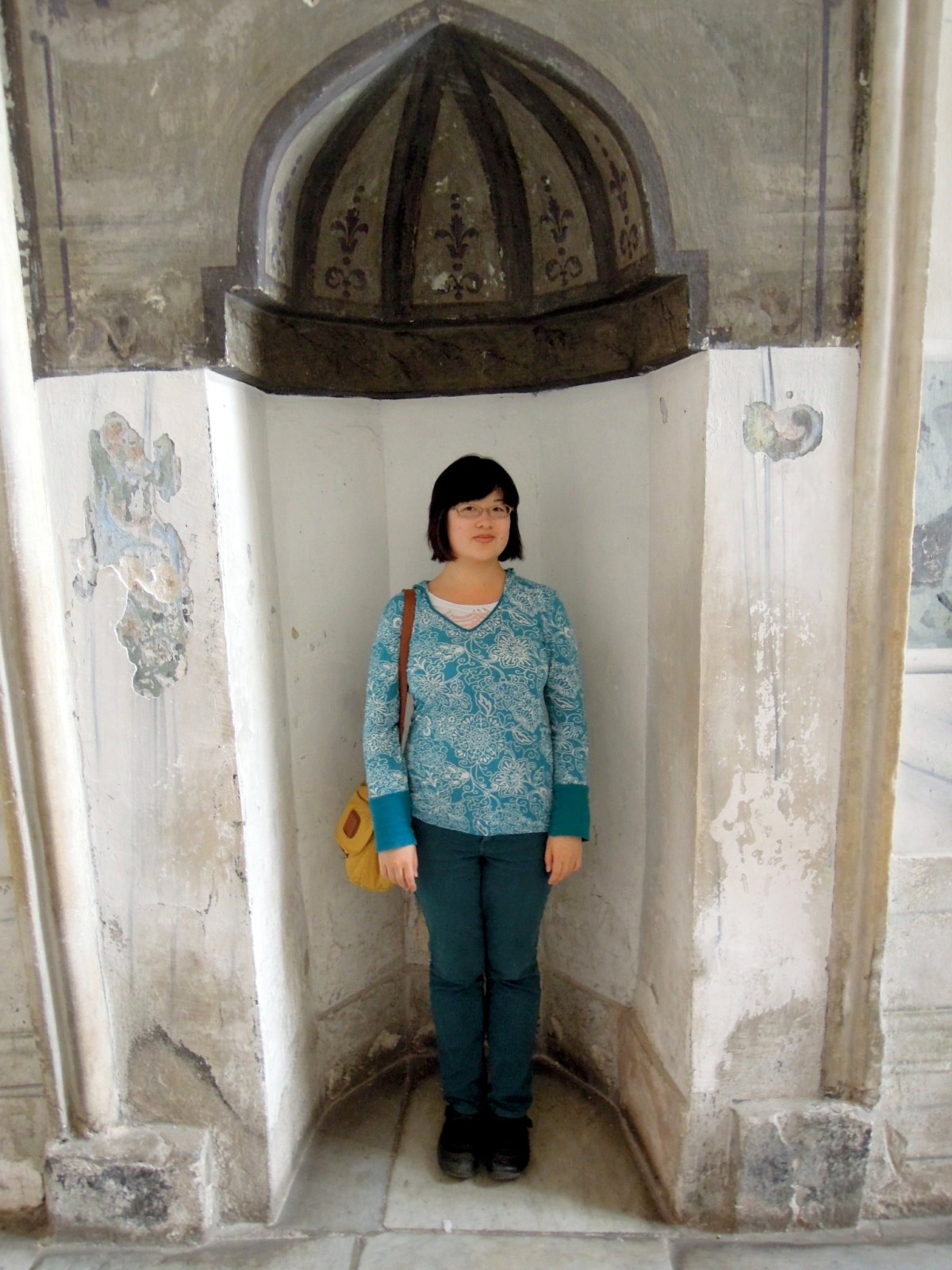 Lisa standing in an alcove