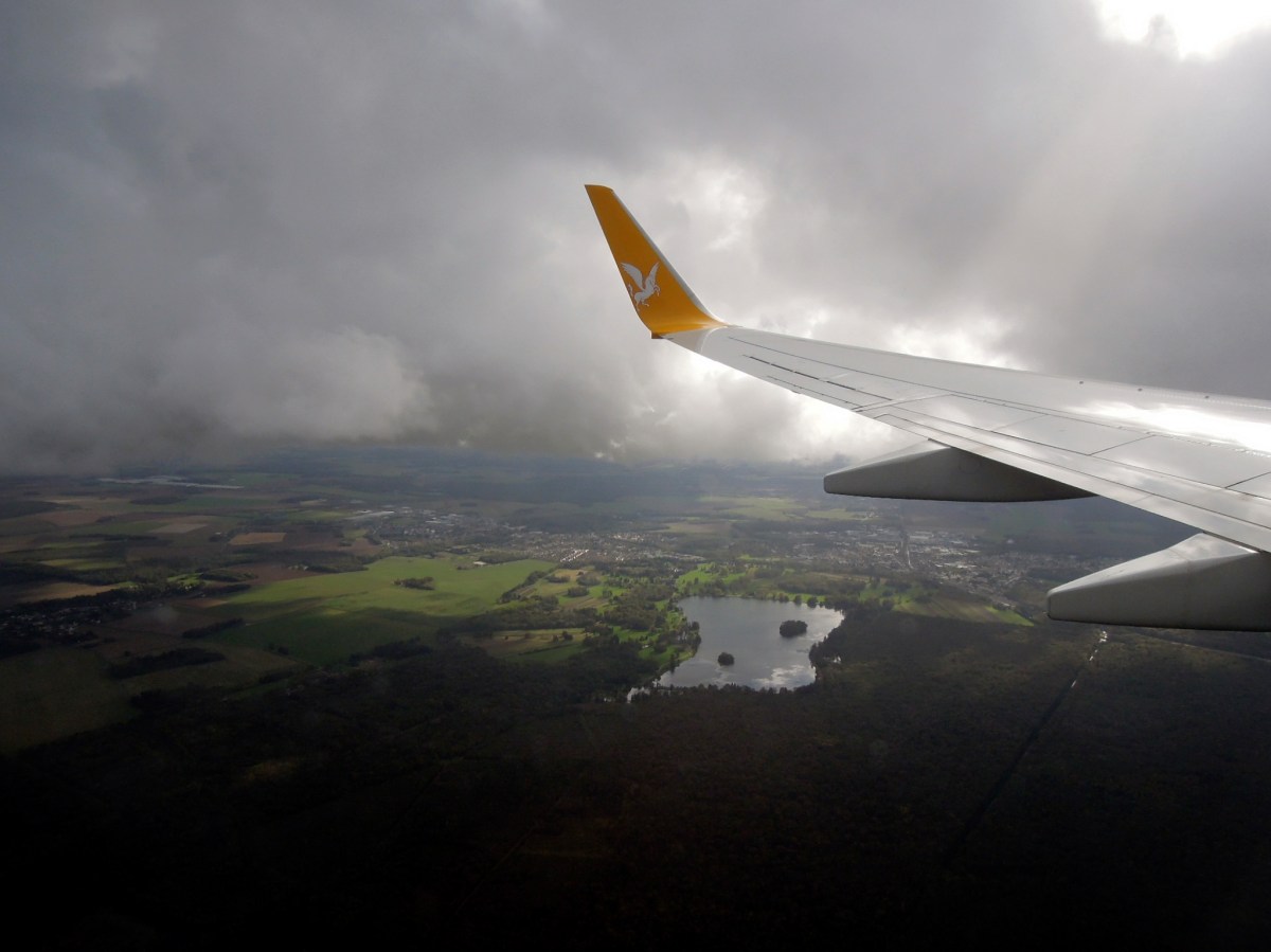 Aerial view of a lake and woods outside Paris