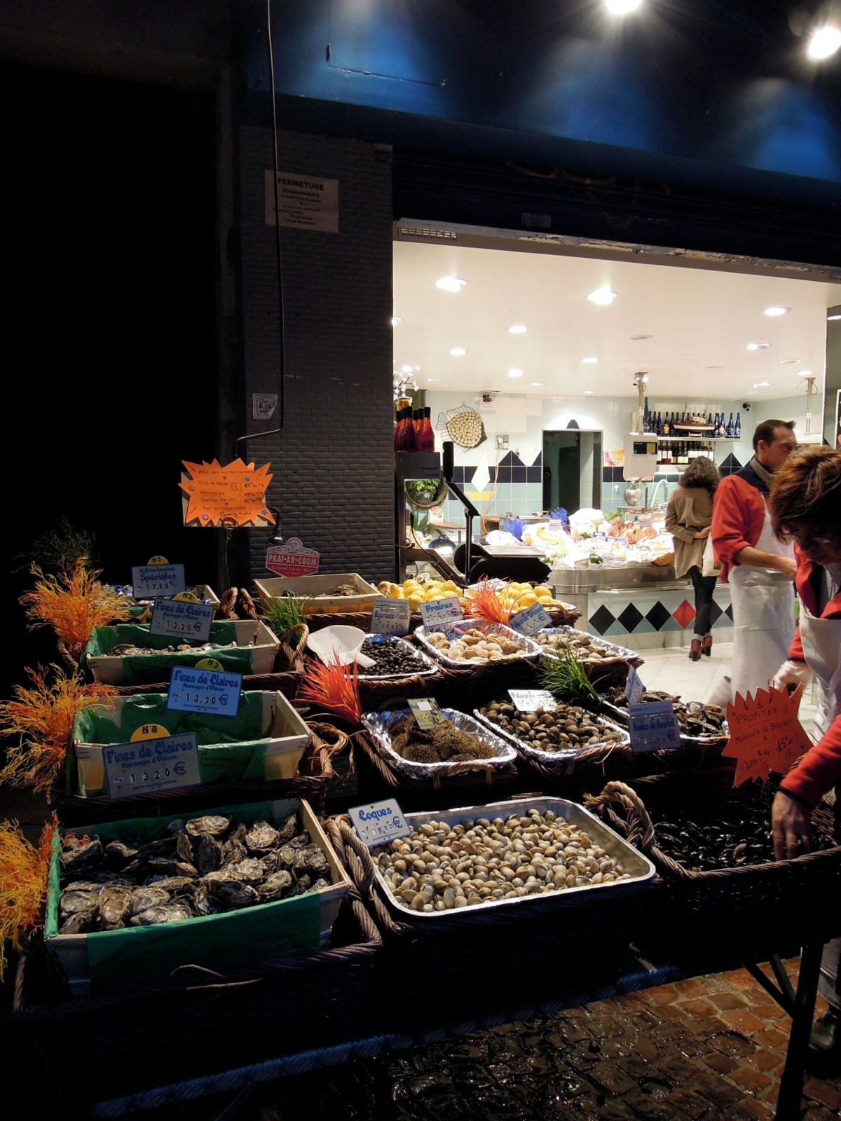 Outside display at a poissonnerie, at night