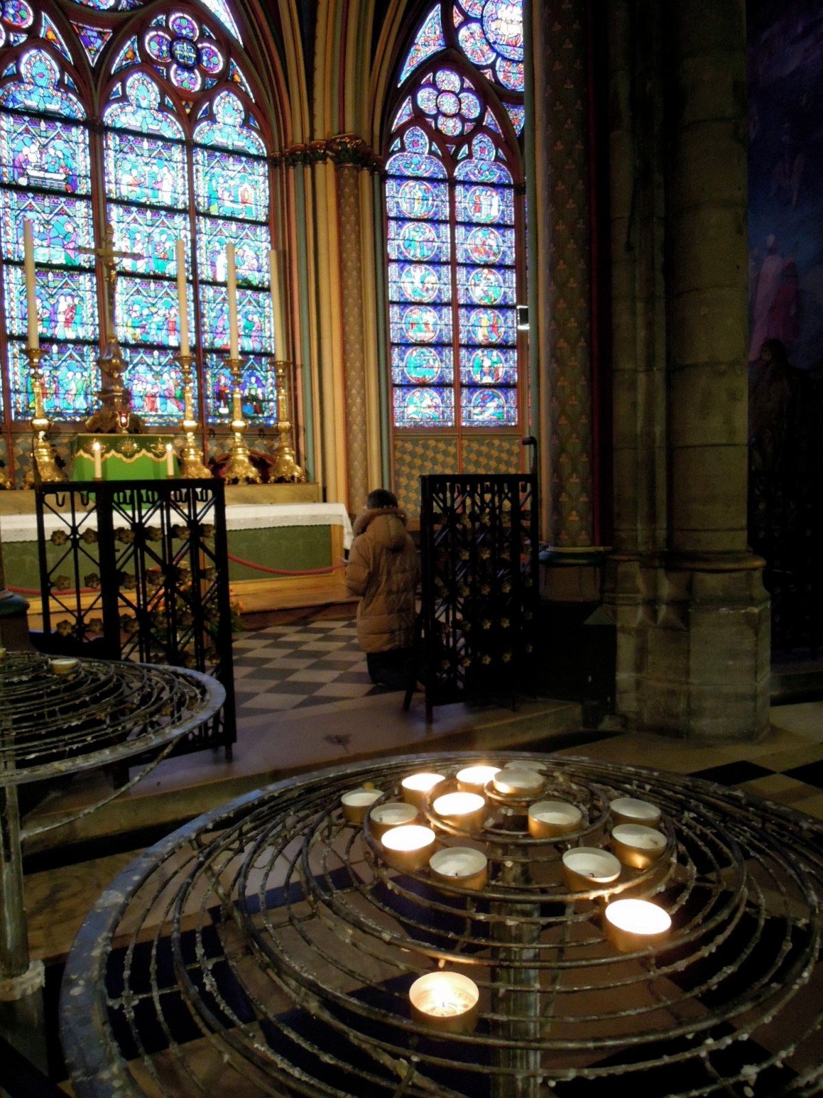 Prayer area with stained glass windows and candles