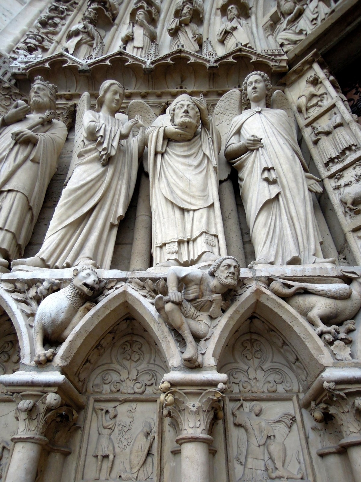Elaborate carved statues on the side of the building exterior
