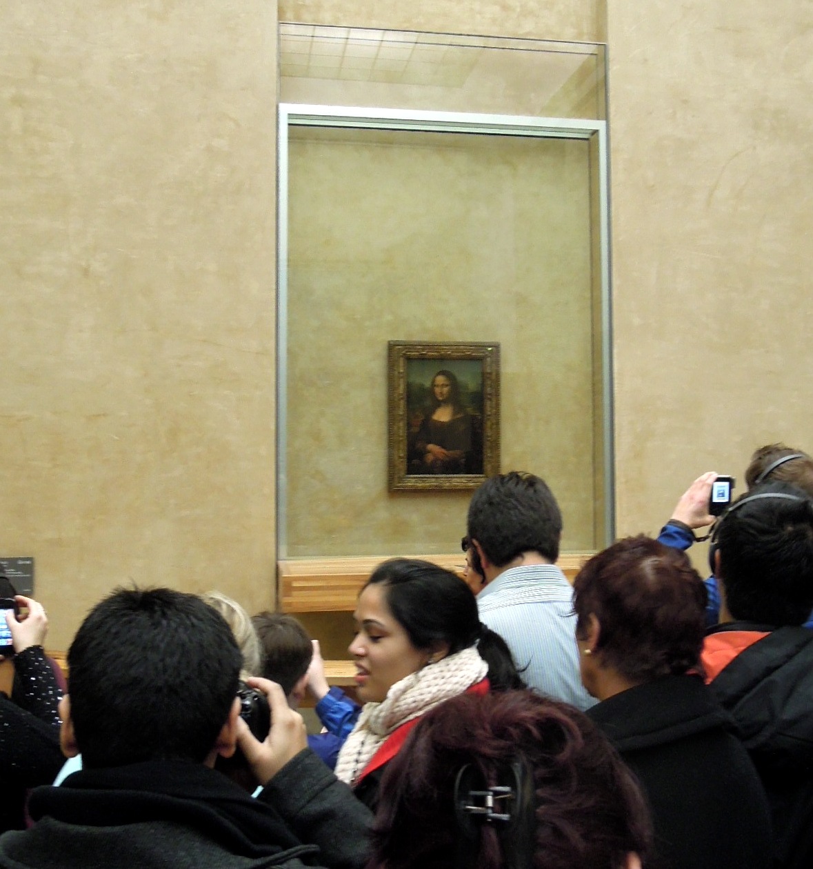 The Mona Lisa, surrounded by people and cameras