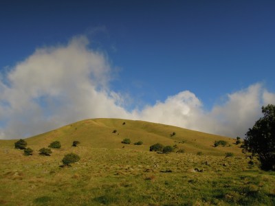 Picture-perfect green hill, blue sky