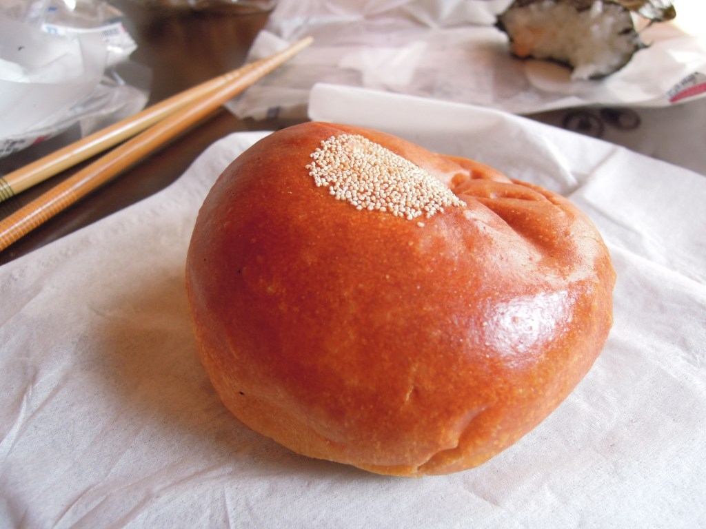 Red bean bun with circle pattern of little seeds on top