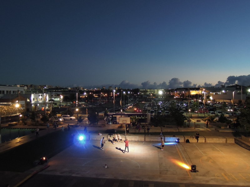 A lively basketball game with lights and even a DJ