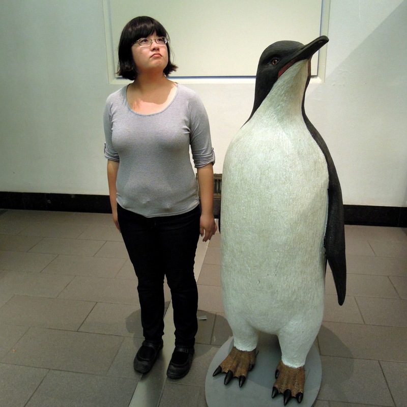 Mimicking a penguin sculpture