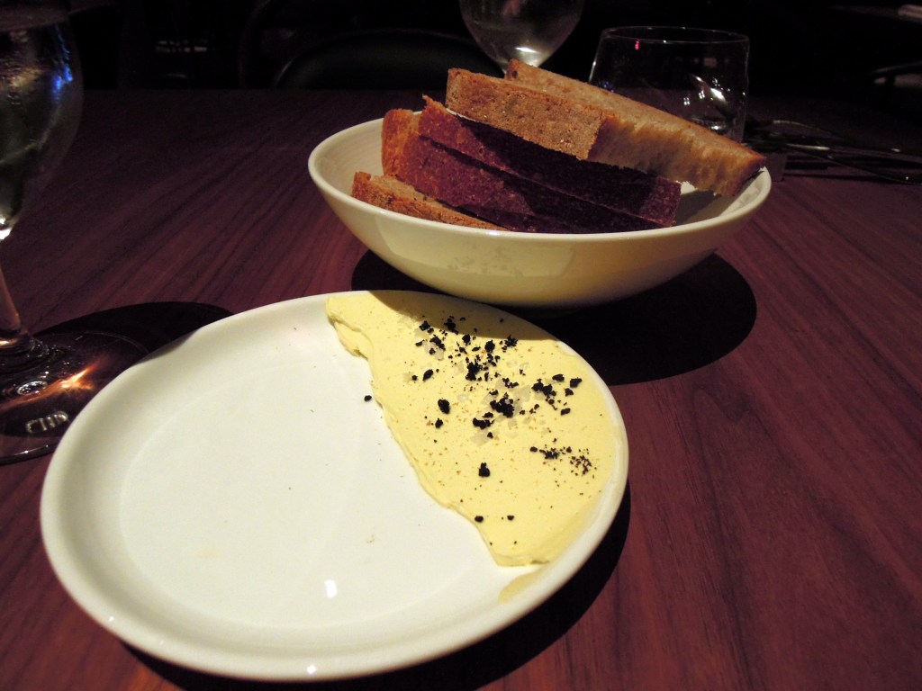 Bread and butter sprinkled with black olive crumbles and sea salt and I can't remember what else