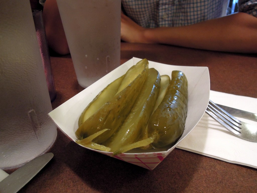 Paper food tray of halved pickles