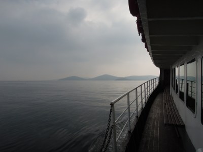 View of the Sea of Marmara, the edge of a ferryboat railing, and distant islands