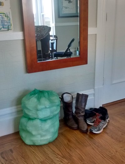 Diapers in green compostable bag