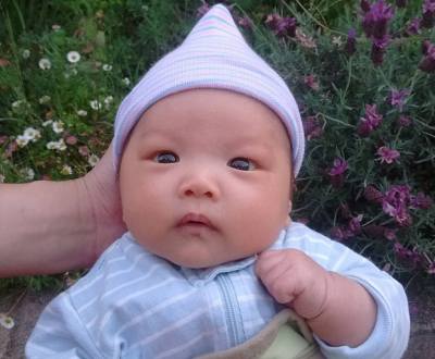 Seven-week-old baby Ada with pointy hat