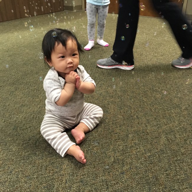 Baby Ada charmed by bubbles