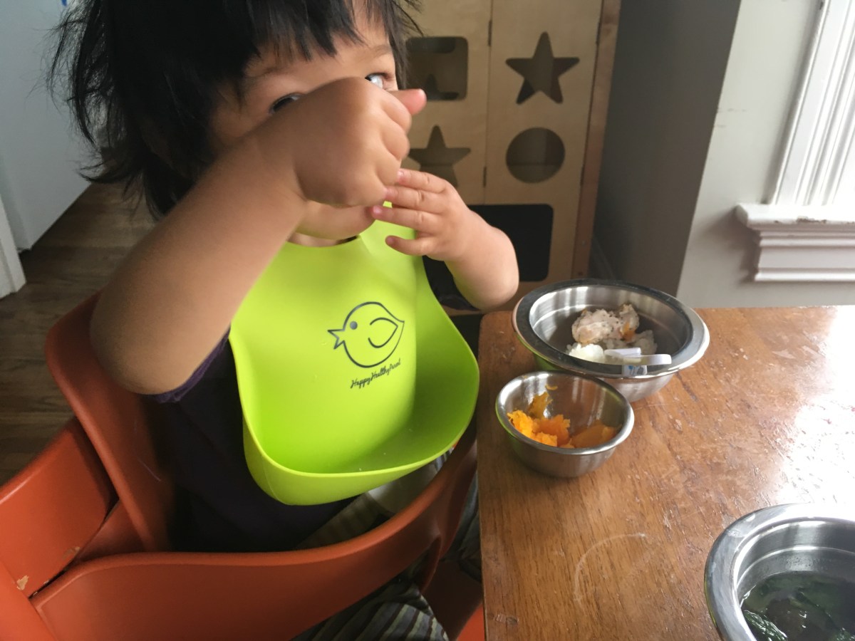 Toddler eating at the table