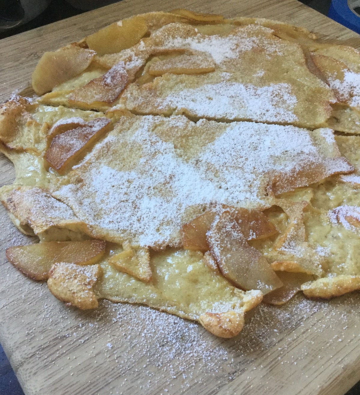 A collapsed David Eyre's pancake, with apple slices