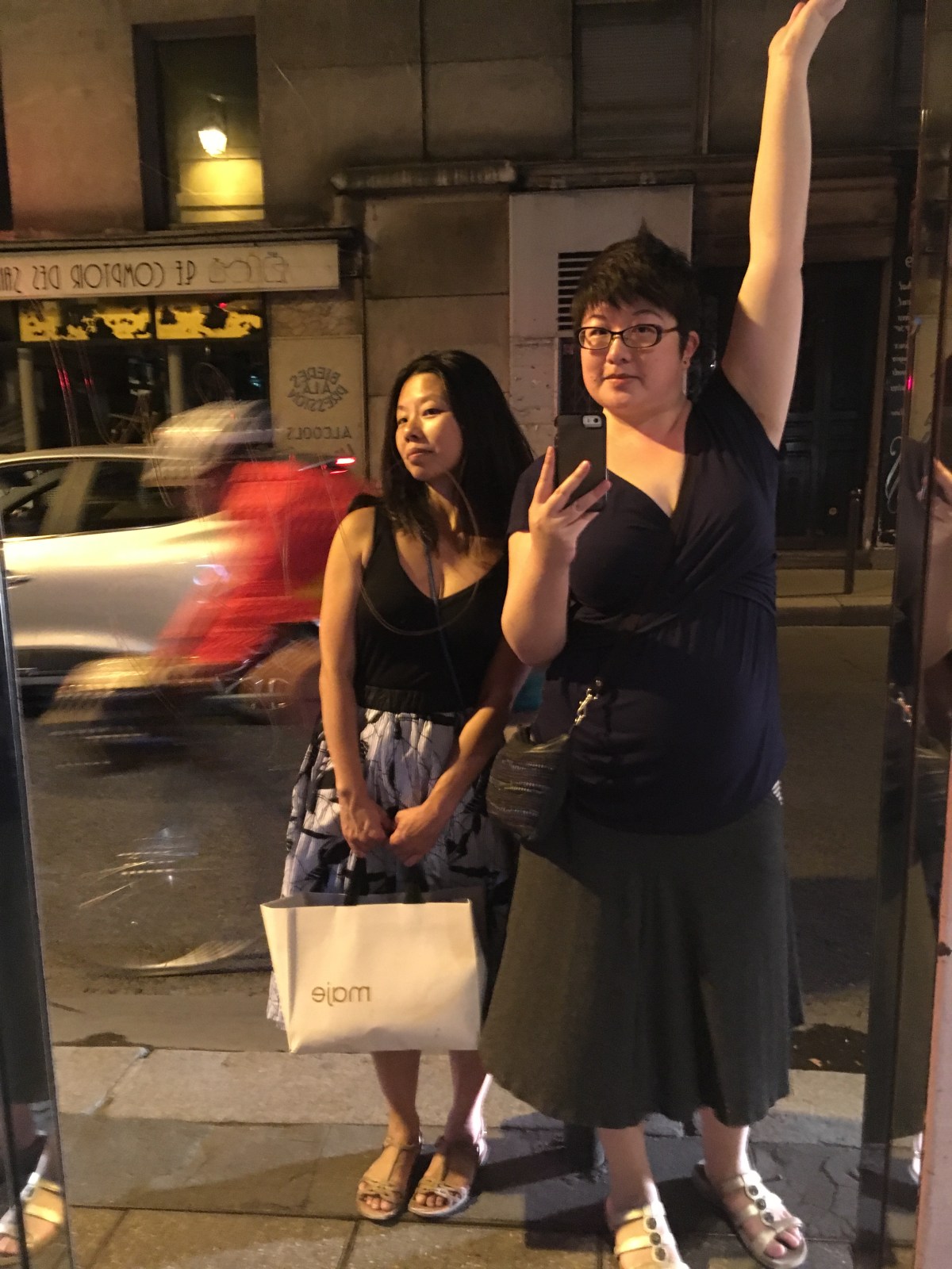 Friends posing at night